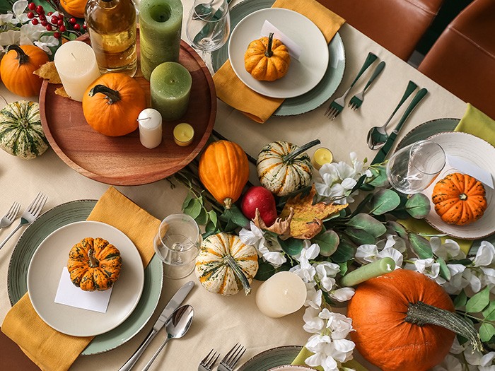 tablescape with pumpkins in orange, green and mixed.